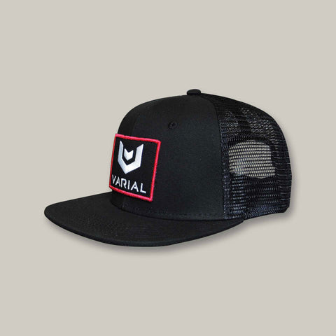 Varial  logo trucker hat with varial surf technology logo. Black, red and grey trucker hats avaialable