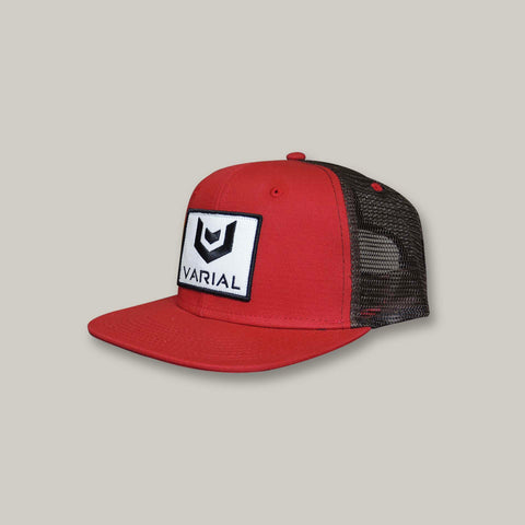 Varial surf technology surf brand clothing. Red + brown trucker hat with varials signature logo.